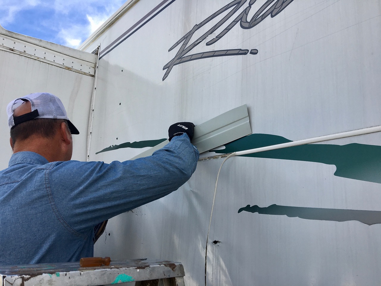 Screws every 4 inches into metal strip under bothe panel